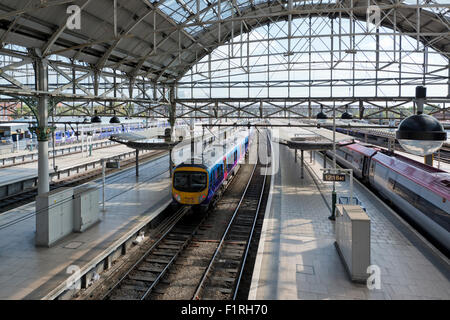 The inside of Manchester Piccadilly railway train station on a sunny day. Stock Photo