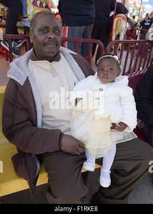 Baby girl enjoys day with her grandfather at Coney Island in Brooklyn, New York. Stock Photo