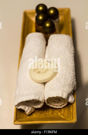 White towels, soap, shampoo in bathroom on hotel Stock Photo