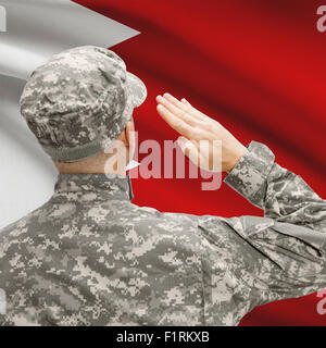 National military forces with flag on background conceptual series - Bahrain Stock Photo