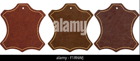 Three brown leather signs isolated on white background with clipping path Stock Photo