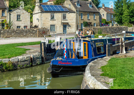 Canal Boat passing through lock gates Bradford on Avon Wiltshire Stock Photo