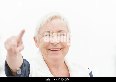 Smililing senior woman with grey hair Stock Photo
