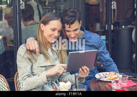 Paris, couple with a digital tablet Stock Photo