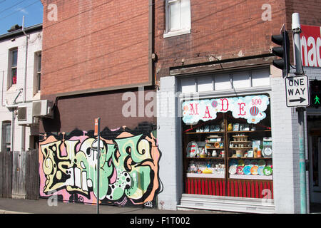 shop and walled graffiti on king street, Newtown suburb of Sydney Australia Stock Photo