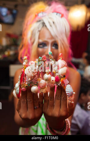 Ayuyun, a member of staff, shows off her nail art at the Ganguro Cafe & Bar in the Shibuya shopping area on September 4, 2015. Ganguro is an alternative Japanese fashion trend which started in the mid-1990s where young women, rebelling against the traditional idea of Japanese beauty, wore colorful make-up and clothes and had dark-skin. 10 Ganguro fashion girls work in the new bar, which offers original Ganguro Balls (fried takoyaki style sausage balls in black squid ink batter) on its menu. Ganguro Café & Bar also offers special services such as Ganguro make-up and the chance to take puriku Stock Photo