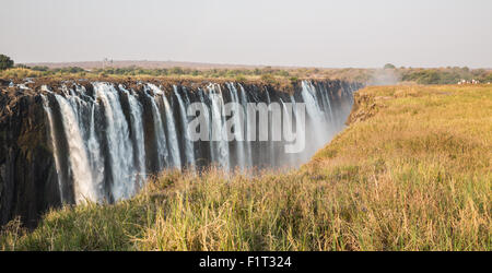 Panoramic view of Victoria Falls with toruists in Zimbabwe Stock Photo