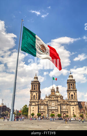 Mexican flag, Plaza of the Constitution (Zocalo), Metropolitan Cathedral in background, Mexico City, Mexico D.F., Mexico Stock Photo