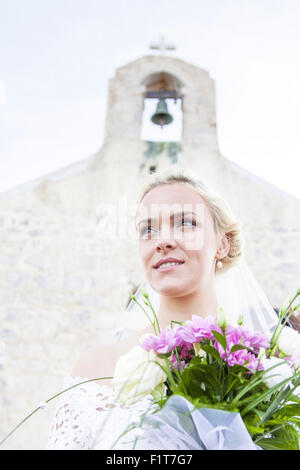 Portrait of bride holding bouquet Stock Photo