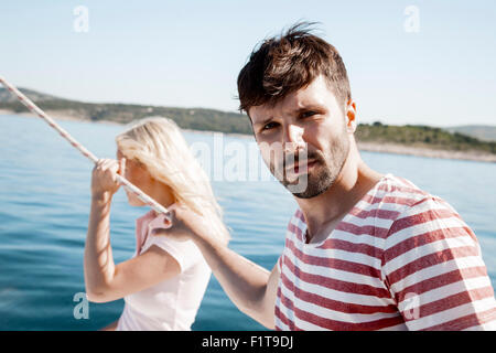 Young couple together on sailboat, Adriatic Sea Stock Photo