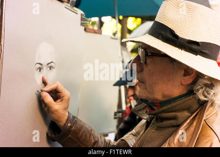 One of the artists working at Place du Tertre, Montmartre.  Near Sacre Coeur. Stock Photo