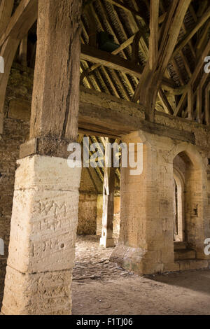 UK, Oxfordshire, Faringdon, Great Coxwell, 14th century Tithe Barn historic grafitti on stone aisle posts Stock Photo