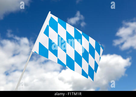 Bavarian flag in front of blue sky with clouds Stock Photo