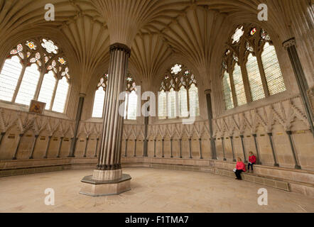 Visitors in the Chapter House, part of the medieval 12th century Wells cathedral, Wells, Somerset England UK Stock Photo