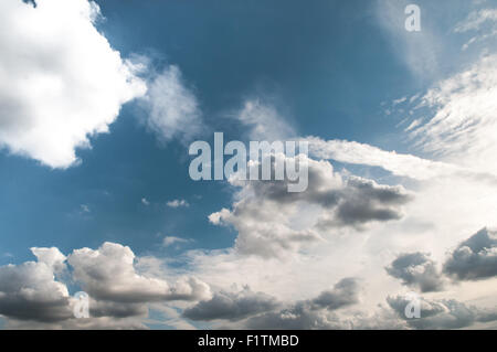 White Fluffy Clouds Fly In Sky. White Cloud With Many Other Clouds 