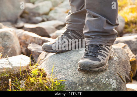 hiker standing on rocks Stock Photo