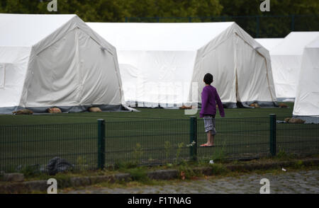 Berlin, Germany. 07th Sep, 2015. Amin stands in front of tents at the Schmidt Knobelsdorf barracks in Berlin, Germany, 07 September 2015. Photo: BRITTA PEDERSEN/dpa/Alamy Live News Stock Photo