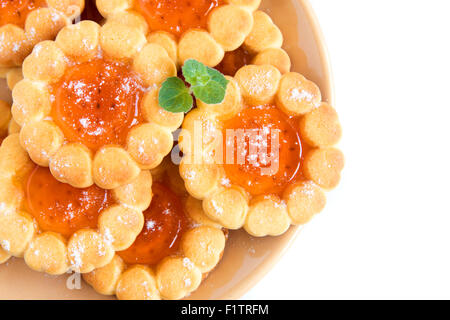 Cookies with fruit orange jelly on plate isolated on white background Stock Photo