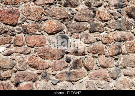 Fragment of the old stone wall as background Stock Photo