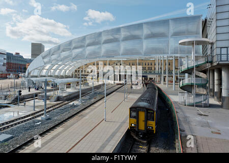 The refurbished Victoria Station in Manchester, as a Northern Rail train emerges Stock Photo