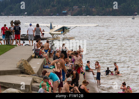 Coeur d' Alene, Idaho - August 01 : Amphibious plane floating on the lake with a crowd of people enjoying a summer day, August 0 Stock Photo