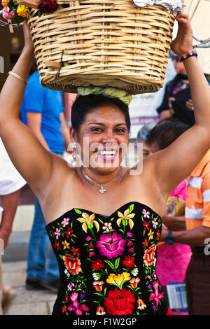 A traditionally dressed Mexican woman in a parade during the July GUELAGUETZA FESTIVAL  - OAXACA, MEXICO Stock Photo