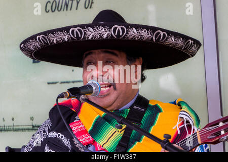 A live performer playing Mexican music on the street,. Stock Photo