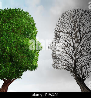 Social ecology and environment change or global warming environmental concept as a scene cut in two with half showing a  healthy green growing plant and the opposite a dead tree shaped as a human head caused by pollution.  . Stock Photo