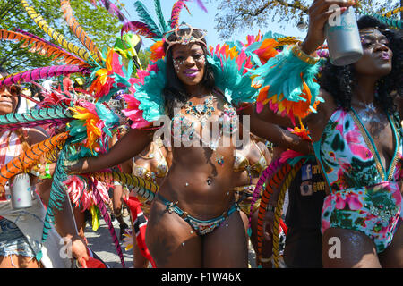 Brooklyn, United States. 07th Sep, 2015. An elaborately costumed dancer pauses to model her outfit. Massive crowds gathered along the Eastern Parkway in Crown Heights, Brooklyn to witness the annual West Indian Day Carnival Parade featuring politicians, dancers and all manner of display of Caribbean heritage. Credit:  Albin Lohr-Jones/Pacific Press/Alamy Live News Stock Photo