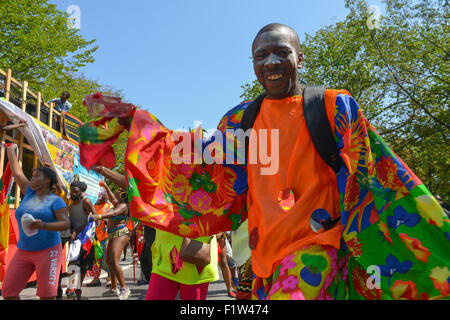 Brooklyn, United States. 07th Sep, 2015. A brightly-colored dancer struts in the parade. Massive crowds gathered along the Eastern Parkway in Crown Heights, Brooklyn to witness the annual West Indian Day Carnival Parade featuring politicians, dancers and all manner of display of Caribbean heritage. Credit:  Albin Lohr-Jones/Pacific Press/Alamy Live News Stock Photo