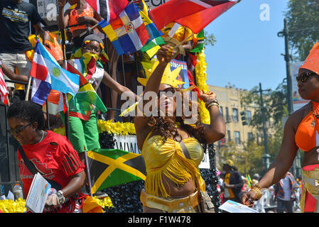 Brooklyn, United States. 07th Sep, 2015. A dancer displays her national pride. Massive crowds gathered along the Eastern Parkway in Crown Heights, Brooklyn to witness the annual West Indian Day Carnival Parade featuring politicians, dancers and all manner of display of Caribbean heritage. Credit:  Albin Lohr-Jones/Pacific Press/Alamy Live News Stock Photo