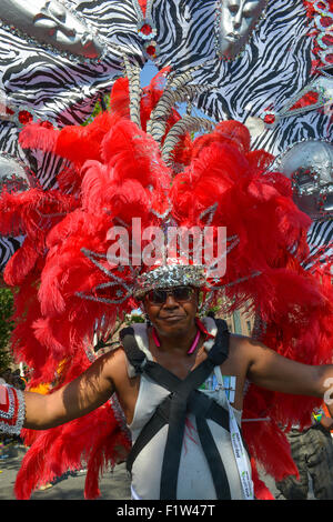 Brooklyn, United States. 07th Sep, 2015. A dancer proudly displays his costume. Massive crowds gathered along the Eastern Parkway in Crown Heights, Brooklyn to witness the annual West Indian Day Carnival Parade featuring politicians, dancers and all manner of display of Caribbean heritage. Credit:  Albin Lohr-Jones/Pacific Press/Alamy Live News Stock Photo