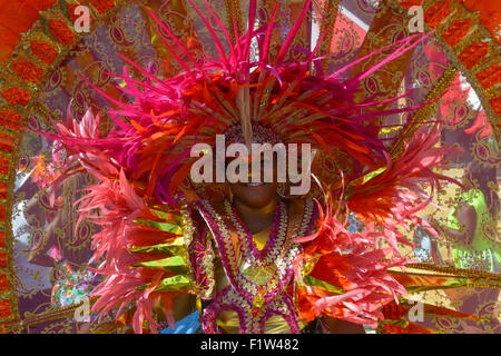 Brooklyn, United States. 07th Sep, 2015. A girl is ensconced in the rings of feathers comprising her costume. Massive crowds gathered along the Eastern Parkway in Crown Heights, Brooklyn to witness the annual West Indian Day Carnival Parade featuring politicians, dancers and all manner of display of Caribbean heritage. Credit:  Albin Lohr-Jones/Pacific Press/Alamy Live News Stock Photo