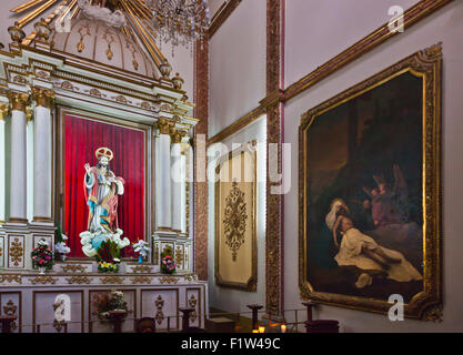 Side CHAPEL with statue of Christ and antique painting in the OAXACAN CATHEDRAL  - OAXACA, MEXICO Stock Photo