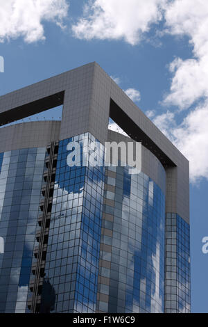Modern office building with sky reflection in windows Stock Photo - Alamy