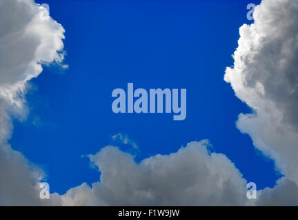 Gloomy Cumulus Clouds Formation on Blue Sky Stock Photo