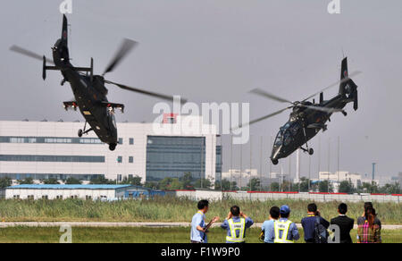 Tianjin, China. 7th Sep, 2015. Gunships practise low-altitude flight for the coming China Helicopter Exposition in a helicopter base of Aviation Industry Corporation of China in the Airport Area of China Pilot Free Trade Zone of Tianjin, north China, Sept. 7, 2015. The exposition will be opened on Sept. 9. © Wang Huan/Xinhua/Alamy Live News Stock Photo