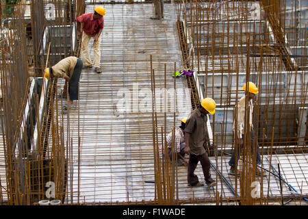 Unidentified workers are employed in construction overhead metro in Bangalore City Stock Photo