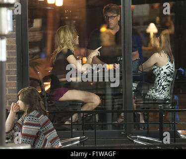 Ann Arbor, MI, USA. 10th June, 2015. The manager talks to customers at the Black Pearl restaurant on Main Street in downtown Ann Arbor, MI. © Mark Bialek/ZUMA Wire/Alamy Live News Stock Photo