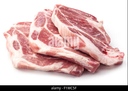 Raw pork meat slices on a white background. Stock Photo