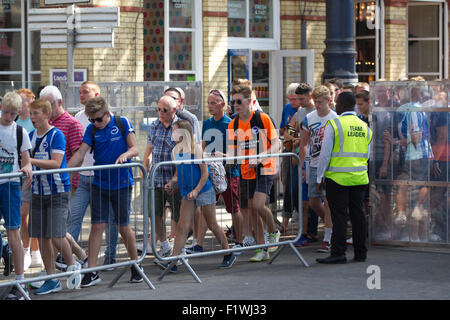 Bighton & Hove football fans travelling from Brighton Rail Station to Falmer Station in transit to the weekend football match. Stock Photo