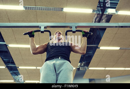 young man exercising in gym Stock Photo
