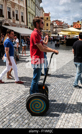 Man riding a Segway in the Old Town Square, Prague, Czech Republic. Stock Photo