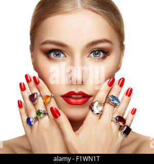 Portrait of beautiful woman with jewelry. Manicure and makeup. Perfect skin. Fashion beauty. Ring. Blonde girl. Close up