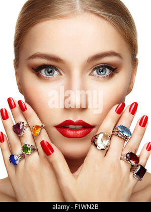 Portrait of beautiful woman with jewelry. Manicure and makeup. Perfect skin. Fashion beauty. Ring. Blonde girl. Close up Stock Photo