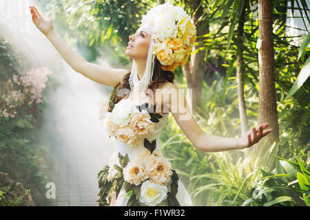 Shiny dark-haired lady in the rain forest Stock Photo