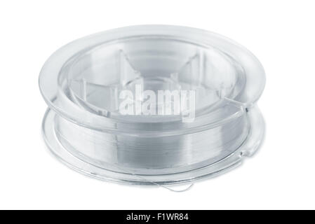 Spool with a fishing line isolated on white Stock Photo - Alamy