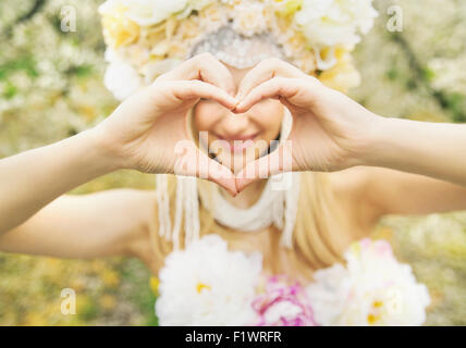 Beautiful woman and the love gesture Stock Photo