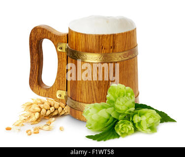 wooden mug with beer, green hops and wheat. Stock Photo