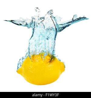 lemon falling in water on the white background. Stock Photo